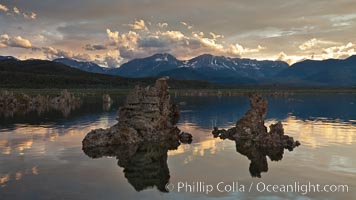 Tufa towers rise from Mono Lake, with the Eastern Sierra visible in the distance. Tufa towers are formed when underwater springs rich in calcium mix with lakewater rich in carbonates, forming calcium carbonate (limestone) structures below the surface of the lake. The towers were eventually revealed when the water level in the lake was lowered starting in 1941