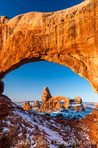 Sunrise light on Turret Arch viewed through North Window, winter. Arches National Park, Utah, USA, natural history stock photograph, photo id 18121