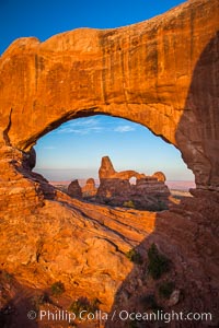 Sunrise light on Turret Arch viewed through North Window, Arches National Park, Utah