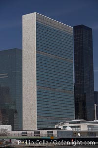 The United Nations Building rises above the New York skyline as viewed from the East River, Manhattan, New York City