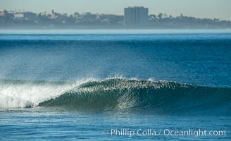 Unridden wave at Torrey Pines, La Jolla in the distance