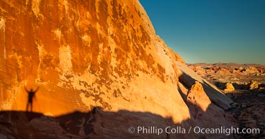 Rising sun creates the photographers shadow on a sandstone wall, Valley of Fire State Park