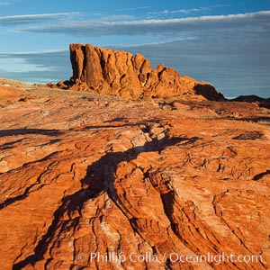 Sandstone striations and butte, dawn.