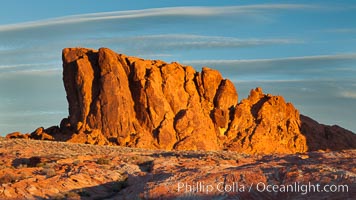 Sandstone striations and butte, dawn.