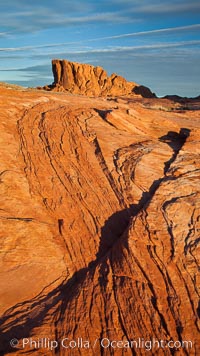 Sandstone striations and butte, dawn.