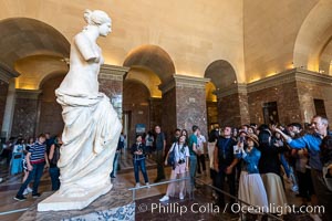 Venus de Milo and her admirers, Musee du Louvre, Paris, France
