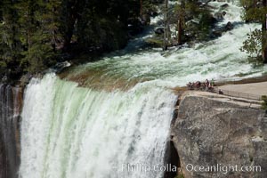 Merced River is swollen and wide at the brink of Vernal Falls, Yosemite National Park.