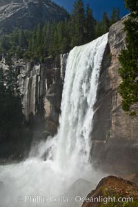 Vernal Falls and Merced River in complete spring flood, heavy flow due to snow melt in the high country above Yosemite Valley.