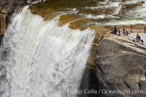 The Brink of Vernal Falls. Hikers are seen at the precipice to Vernal Falls, having hiked up the Mist Trail to get there.