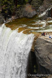 Vernal Falls at peak flow in late spring. Hikers are seen at the precipice to Vernal Falls, having hiked up the Mist Trail to get there. Yosemite National Park, California, USA, natural history stock photograph, photo id 12637