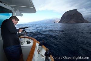 Videographer filming approach to Guadalupe Island, Guadalupe Island (Isla Guadalupe)