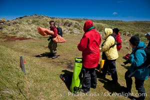 Visitors walk across Carcass Island, named for the HMS Carcass which surveyed the island in 1766