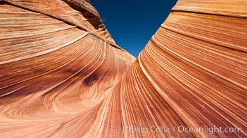 The Wave, an area of fantastic eroded sandstone featuring beautiful swirls, wild colors, countless striations, and bizarre shapes set amidst the dramatic surrounding North Coyote Buttes of Arizona and Utah.  The sandstone formations of the North Coyote Buttes, including the Wave, date from the Jurassic period. Managed by the Bureau of Land Management, the Wave is located in the Paria Canyon-Vermilion Cliffs Wilderness and is accessible on foot by permit only