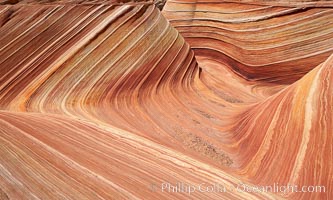 The Wave, an area of fantastic eroded sandstone featuring beautiful swirls, wild colors, countless striations, and bizarre shapes set amidst the dramatic surrounding North Coyote Buttes of Arizona and Utah.  The sandstone formations of the North Coyote Buttes, including the Wave, date from the Jurassic period. Managed by the Bureau of Land Management, the Wave is located in the Paria Canyon-Vermilion Cliffs Wilderness and is accessible on foot by permit only