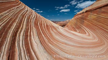 The Wave, an area of fantastic eroded sandstone featuring beautiful swirls, wild colors, countless striations, and bizarre shapes set amidst the dramatic surrounding North Coyote Buttes of Arizona and Utah.  The sandstone formations of the North Coyote Buttes, including the Wave, date from the Jurassic period. Managed by the Bureau of Land Management, the Wave is located in the Paria Canyon-Vermilion Cliffs Wilderness and is accessible on foot by permit only