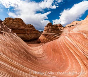 The Wave in the North Coyote Buttes, an area of fantastic eroded sandstone featuring beautiful swirls, wild colors, countless striations, and bizarre shapes set amidst the dramatic surrounding North Coyote Buttes of Arizona and Utah. The sandstone formations of the North Coyote Buttes, including the Wave, date from the Jurassic period. Managed by the Bureau of Land Management, the Wave is located in the Paria Canyon-Vermilion Cliffs Wilderness and is accessible on foot by permit only. USA, natural history stock photograph, photo id 28600