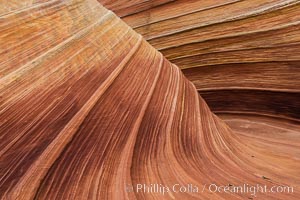 The Wave in the North Coyote Buttes, an area of fantastic eroded sandstone featuring beautiful swirls, wild colors, countless striations, and bizarre shapes set amidst the dramatic surrounding North Coyote Buttes of Arizona and Utah. The sandstone formations of the North Coyote Buttes, including the Wave, date from the Jurassic period. Managed by the Bureau of Land Management, the Wave is located in the Paria Canyon-Vermilion Cliffs Wilderness and is accessible on foot by permit only.