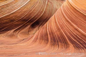 The Wave in the North Coyote Buttes, an area of fantastic eroded sandstone featuring beautiful swirls, wild colors, countless striations, and bizarre shapes set amidst the dramatic surrounding North Coyote Buttes of Arizona and Utah. The sandstone formations of the North Coyote Buttes, including the Wave, date from the Jurassic period. Managed by the Bureau of Land Management, the Wave is located in the Paria Canyon-Vermilion Cliffs Wilderness and is accessible on foot by permit only.