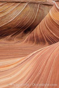 The Wave in the North Coyote Buttes, an area of fantastic eroded sandstone featuring beautiful swirls, wild colors, countless striations, and bizarre shapes set amidst the dramatic surrounding North Coyote Buttes of Arizona and Utah. The sandstone formations of the North Coyote Buttes, including the Wave, date from the Jurassic period. Managed by the Bureau of Land Management, the Wave is located in the Paria Canyon-Vermilion Cliffs Wilderness and is accessible on foot by permit only