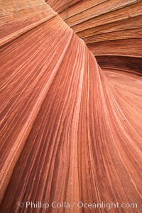 The Wave in the North Coyote Buttes, an area of fantastic eroded sandstone featuring beautiful swirls, wild colors, countless striations, and bizarre shapes set amidst the dramatic surrounding North Coyote Buttes of Arizona and Utah. The sandstone formations of the North Coyote Buttes, including the Wave, date from the Jurassic period. Managed by the Bureau of Land Management, the Wave is located in the Paria Canyon-Vermilion Cliffs Wilderness and is accessible on foot by permit only