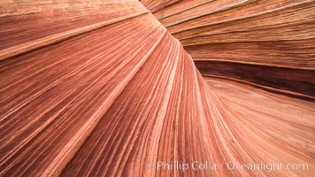 The Wave in the North Coyote Buttes, an area of fantastic eroded sandstone featuring beautiful swirls, wild colors, countless striations, and bizarre shapes set amidst the dramatic surrounding North Coyote Buttes of Arizona and Utah. The sandstone formations of the North Coyote Buttes, including the Wave, date from the Jurassic period. Managed by the Bureau of Land Management, the Wave is located in the Paria Canyon-Vermilion Cliffs Wilderness and is accessible on foot by permit only