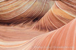 The Wave in the North Coyote Buttes, an area of fantastic eroded sandstone featuring beautiful swirls, wild colors, countless striations, and bizarre shapes set amidst the dramatic surrounding North Coyote Buttes of Arizona and Utah. The sandstone formations of the North Coyote Buttes, including the Wave, date from the Jurassic period. Managed by the Bureau of Land Management, the Wave is located in the Paria Canyon-Vermilion Cliffs Wilderness and is accessible on foot by permit only