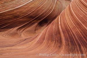 The Wave in the North Coyote Buttes, an area of fantastic eroded sandstone featuring beautiful swirls, wild colors, countless striations, and bizarre shapes set amidst the dramatic surrounding North Coyote Buttes of Arizona and Utah. The sandstone formations of the North Coyote Buttes, including the Wave, date from the Jurassic period. Managed by the Bureau of Land Management, the Wave is located in the Paria Canyon-Vermilion Cliffs Wilderness and is accessible on foot by permit only