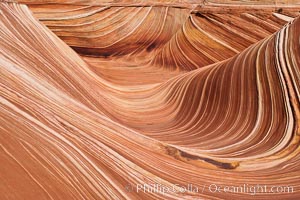 The Wave, an area of fantastic eroded sandstone featuring beautiful swirls, wild colors, countless striations, and bizarre shapes set amidst the dramatic surrounding North Coyote Buttes of Arizona and Utah.  The sandstone formations of the North Coyote Buttes, including the Wave, date from the Jurassic period. Managed by the Bureau of Land Management, the Wave is located in the Paria Canyon-Vermilion Cliffs Wilderness and is accessible on foot by permit only