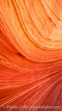 The Wave, an area of fantastic eroded sandstone featuring beautiful swirls, wild colors, countless striations, and bizarre shapes set amidst the dramatic surrounding North Coyote Buttes of Arizona and Utah.  The sandstone formations of the North Coyote Buttes, including the Wave, date from the Jurassic period. Managed by the Bureau of Land Management, the Wave is located in the Paria Canyon-Vermilion Cliffs Wilderness and is accessible on foot by permit only.