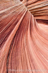 The Wave, an area of fantastic eroded sandstone featuring beautiful swirls, wild colors, countless striations, and bizarre shapes set amidst the dramatic surrounding North Coyote Buttes of Arizona and Utah.  The sandstone formations of the North Coyote Buttes, including the Wave, date from the Jurassic period. Managed by the Bureau of Land Management, the Wave is located in the Paria Canyon-Vermilion Cliffs Wilderness and is accessible on foot by permit only