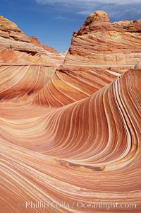 The Wave, an area of fantastic eroded sandstone featuring beautiful swirls, wild colors, countless striations, and bizarre shapes set amidst the dramatic surrounding North Coyote Buttes of Arizona and Utah.  The sandstone formations of the North Coyote Buttes, including the Wave, date from the Jurassic period. Managed by the Bureau of Land Management, the Wave is located in the Paria Canyon-Vermilion Cliffs Wilderness and is accessible on foot by permit only