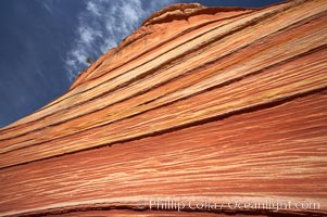 The Wave, an area of fantastic eroded sandstone featuring beautiful swirls, wild colors, countless striations, and bizarre shapes set amidst the dramatic surrounding North Coyote Buttes of Arizona and Utah.  The sandstone formations of the North Coyote Buttes, including the Wave, date from the Jurassic period. Managed by the Bureau of Land Management, the Wave is located in the Paria Canyon-Vermilion Cliffs Wilderness and is accessible on foot by permit only