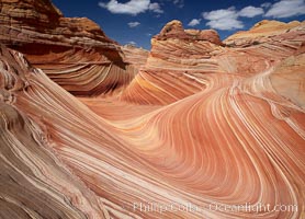 The Wave, an area of fantastic eroded sandstone featuring beautiful swirls, wild colors, countless striations, and bizarre shapes set amidst the dramatic surrounding North Coyote Buttes of Arizona and Utah.  The sandstone formations of the North Coyote Buttes, including the Wave, date from the Jurassic period. Managed by the Bureau of Land Management, the Wave is located in the Paria Canyon-Vermilion Cliffs Wilderness and is accessible on foot by permit only