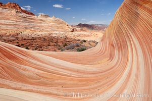 The Wave, an area of fantastic eroded sandstone featuring beautiful swirls, wild colors, countless striations, and bizarre shapes set amidst the dramatic surrounding North Coyote Buttes of Arizona and Utah.  The sandstone formations of the North Coyote Buttes, including the Wave, date from the Jurassic period. Managed by the Bureau of Land Management, the Wave is located in the Paria Canyon-Vermilion Cliffs Wilderness and is accessible on foot by permit only.