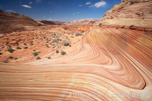 The Wave, an area of fantastic eroded sandstone featuring beautiful swirls, wild colors, countless striations, and bizarre shapes set amidst the dramatic surrounding North Coyote Buttes of Arizona and Utah.  The sandstone formations of the North Coyote Buttes, including the Wave, date from the Jurassic period. Managed by the Bureau of Land Management, the Wave is located in the Paria Canyon-Vermilion Cliffs Wilderness and is accessible on foot by permit only