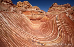 The Wave, an area of fantastic eroded sandstone featuring beautiful swirls, wild colors, countless striations, and bizarre shapes set amidst the dramatic surrounding North Coyote Buttes of Arizona and Utah.  The sandstone formations of the North Coyote Buttes, including the Wave, date from the Jurassic period. Managed by the Bureau of Land Management, the Wave is located in the Paria Canyon-Vermilion Cliffs Wilderness and is accessible on foot by permit only