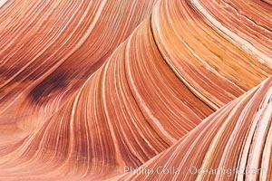 The Wave, an area of fantastic eroded sandstone featuring beautiful swirls, wild colors, countless striations, and bizarre shapes set amidst the dramatic surrounding North Coyote Buttes of Arizona and Utah.  The sandstone formations of the North Coyote Buttes, including the Wave, date from the Jurassic period. Managed by the Bureau of Land Management, the Wave is located in the Paria Canyon-Vermilion Cliffs Wilderness and is accessible on foot by permit only