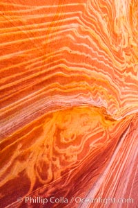 The Wave, an area of fantastic eroded sandstone featuring beautiful swirls, wild colors, countless striations, and bizarre shapes set amidst the dramatic surrounding North Coyote Buttes of Arizona and Utah.  The sandstone formations of the North Coyote Buttes, including the Wave, date from the Jurassic period. Managed by the Bureau of Land Management, the Wave is located in the Paria Canyon-Vermilion Cliffs Wilderness and is accessible on foot by permit only