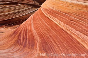 The Wave, an area of fantastic eroded sandstone featuring beautiful swirls, wild colors, countless striations, and bizarre shapes set amidst the dramatic surrounding North Coyote Buttes of Arizona and Utah.  The sandstone formations of the North Coyote Buttes, including the Wave, date from the Jurassic period. Managed by the Bureau of Land Management, the Wave is located in the Paria Canyon-Vermilion Cliffs Wilderness and is accessible on foot by permit only