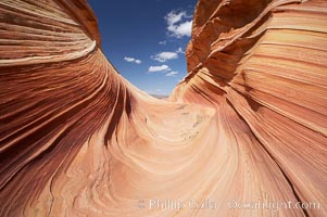 The Wave, an area of fantastic eroded sandstone featuring beautiful swirls, wild colors, countless striations, and bizarre shapes set amidst the dramatic surrounding North Coyote Buttes of Arizona and Utah.  The sandstone formations of the North Coyote Buttes, including the Wave, date from the Jurassic period. Managed by the Bureau of Land Management, the Wave is located in the Paria Canyon-Vermilion Cliffs Wilderness and is accessible on foot by permit only