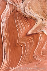 The Wave, an area of fantastic eroded sandstone featuring beautiful swirls, wild colors, countless striations, and bizarre shapes set amidst the dramatic surrounding North Coyote Buttes of Arizona and Utah.  The sandstone formations of the North Coyote Buttes, including the Wave, date from the Jurassic period. Managed by the Bureau of Land Management, the Wave is located in the Paria Canyon-Vermilion Cliffs Wilderness and is accessible on foot by permit only