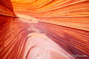 The Wave, an area of fantastic eroded sandstone featuring beautiful swirls, wild colors, countless striations, and bizarre shapes set amidst the dramatic surrounding North Coyote Buttes of Arizona and Utah.  The sandstone formations of the North Coyote Buttes, including the Wave, date from the Jurassic period. Managed by the Bureau of Land Management, the Wave is located in the Paria Canyon-Vermilion Cliffs Wilderness and is accessible on foot by permit only