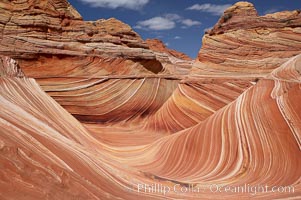 The Wave, an area of fantastic eroded sandstone featuring beautiful swirls, wild colors, countless striations, and bizarre shapes set amidst the dramatic surrounding North Coyote Buttes of Arizona and Utah.  The sandstone formations of the North Coyote Buttes, including the Wave, date from the Jurassic period. Managed by the Bureau of Land Management, the Wave is located in the Paria Canyon-Vermilion Cliffs Wilderness and is accessible on foot by permit only