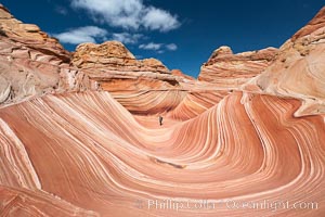 The Wave, an area of fantastic eroded sandstone featuring beautiful swirls, wild colors, countless striations, and bizarre shapes set amidst the dramatic surrounding North Coyote Buttes of Arizona and Utah.  The sandstone formations of the North Coyote Buttes, including the Wave, date from the Jurassic period. Managed by the Bureau of Land Management, the Wave is located in the Paria Canyon-Vermilion Cliffs Wilderness and is accessible on foot by permit only