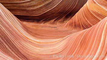 The Wave, an area of fantastic eroded sandstone featuring beautiful swirls, wild colors, countless striations, and bizarre shapes set amidst the dramatic surrounding North Coyote Buttes of Arizona and Utah.  The sandstone formations of the North Coyote Buttes, including the Wave, date from the Jurassic period. Managed by the Bureau of Land Management, the Wave is located in the Paria Canyon-Vermilion Cliffs Wilderness and is accessible on foot by permit only