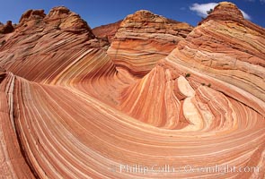 The Wave, an area of fantastic eroded sandstone featuring beautiful swirls, wild colors, countless striations, and bizarre shapes set amidst the dramatic surrounding North Coyote Buttes of Arizona and Utah.  The sandstone formations of the North Coyote Buttes, including the Wave, date from the Jurassic period. Managed by the Bureau of Land Management, the Wave is located in the Paria Canyon-Vermilion Cliffs Wilderness and is accessible on foot by permit only