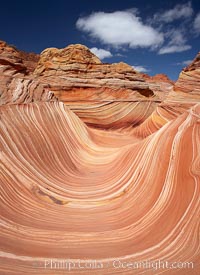 The Wave, an area of fantastic eroded sandstone featuring beautiful swirls, wild colors, countless striations, and bizarre shapes set amidst the dramatic surrounding North Coyote Buttes of Arizona and Utah.  The sandstone formations of the North Coyote Buttes, including the Wave, date from the Jurassic period. Managed by the Bureau of Land Management, the Wave is located in the Paria Canyon-Vermilion Cliffs Wilderness and is accessible on foot by permit only