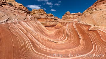 The Wave, an area of fantastic eroded sandstone featuring beautiful swirls, wild colors, countless striations, and bizarre shapes set amidst the dramatic surrounding North Coyote Buttes of Arizona and Utah.  The sandstone formations of the North Coyote Buttes, including the Wave, date from the Jurassic period. Managed by the Bureau of Land Management, the Wave is located in the Paria Canyon-Vermilion Cliffs Wilderness and is accessible on foot by permit only