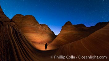 The Wave at Night, under a clear night sky full of stars.  The Wave, an area of fantastic eroded sandstone featuring beautiful swirls, wild colors, countless striations, and bizarre shapes set amidst the dramatic surrounding North Coyote Buttes of Arizona and Utah. The sandstone formations of the North Coyote Buttes, including the Wave, date from the Jurassic period. Managed by the Bureau of Land Management, the Wave is located in the Paria Canyon-Vermilion Cliffs Wilderness and is accessible on foot by permit only