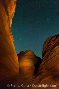 The Wave at Night, under a clear night sky full of stars.  The Wave, an area of fantastic eroded sandstone featuring beautiful swirls, wild colors, countless striations, and bizarre shapes set amidst the dramatic surrounding North Coyote Buttes of Arizona and Utah. The sandstone formations of the North Coyote Buttes, including the Wave, date from the Jurassic period. Managed by the Bureau of Land Management, the Wave is located in the Paria Canyon-Vermilion Cliffs Wilderness and is accessible on foot by permit only.